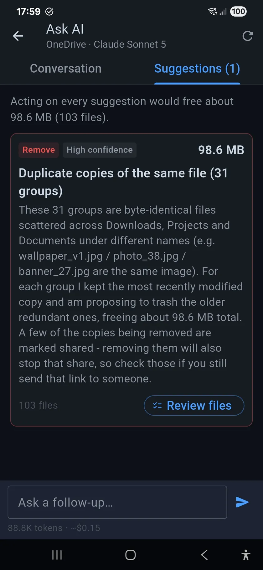 Suggestions tab: a Remove, high-confidence suggestion of 98.6 MB for duplicate copies across 31 groups, with the reasoning and a Review files button